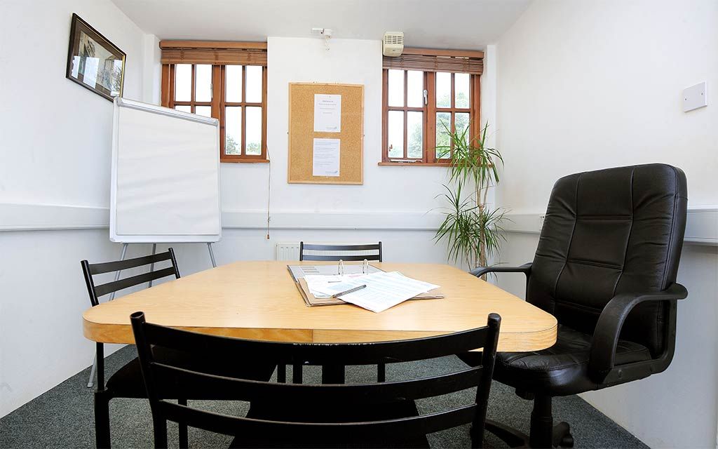 Office 8a shown with desk and chairs